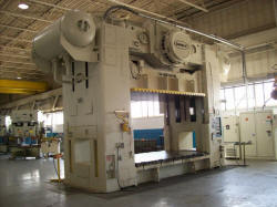 For sale used 600 Ton Danly mechanical press with T-slide and moving bolster